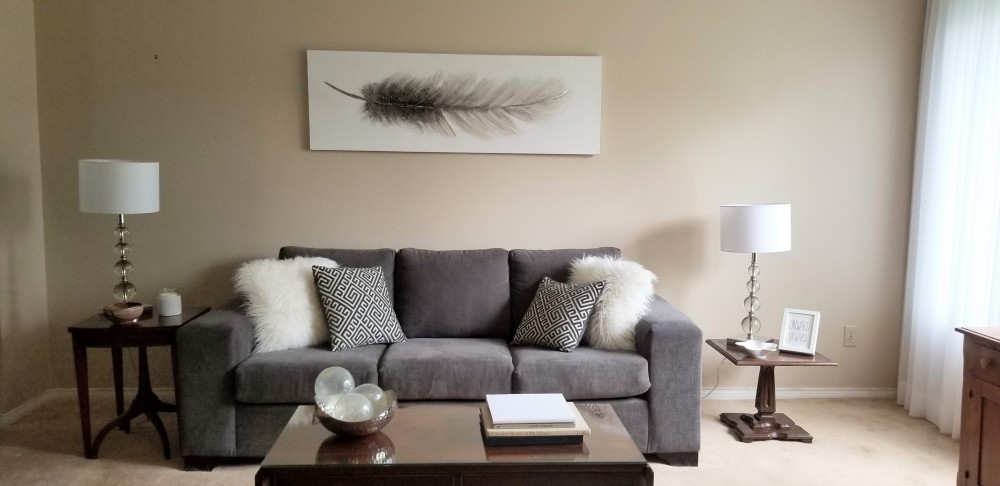 Sheers add to the summer decor. Sheers work in rooms with different design styles. They work in this transitional living room too.